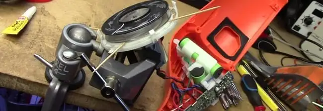 Vacuum cleaner repair parts and tools on a workbench in Anaheim, CA